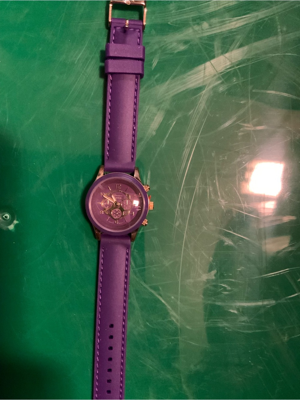 Geneva Platinum Purple Women’s Fashion watch with gold accents.